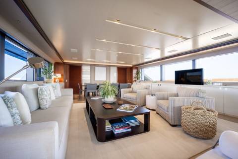 Luxurious yacht interiors offer a serene retreat with plush seating, elegant dining, and stunning ocean views.