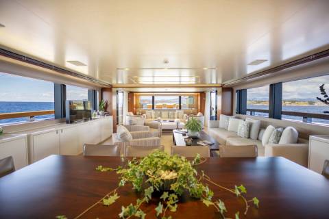 Luxurious yacht interiors offer stunning ocean views and comfortable seating for relaxation and entertaining.