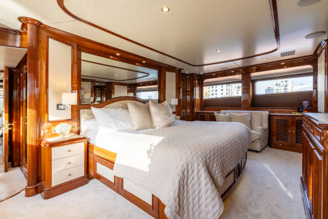 Luxurious wood paneling and plush furnishings create an opulent sanctuary aboard this elegant yacht.
