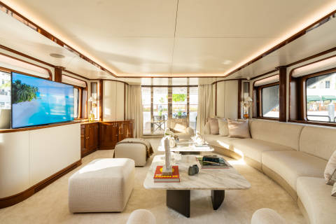 Luxurious yacht interiors offer a serene escape with plush seating and stunning ocean views.