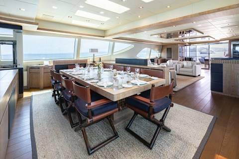Dine in elegant style aboard this luxurious yacht, with a beautifully set table overlooking the sparkling ocean.