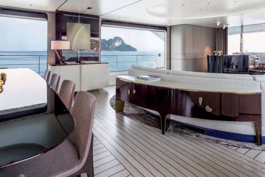 Luxurious yacht interiors offer breathtaking ocean views and elegant furnishings for a serene escape.