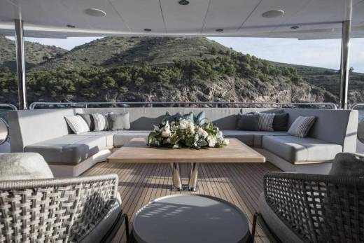 Relax on the luxurious deck of this yacht, surrounded by stunning natural scenery.