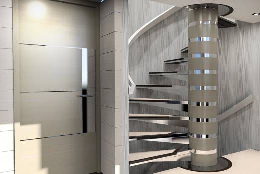 A sleek, modern spiral staircase ascends around a textured column, leading to an upper level of a luxurious interior.