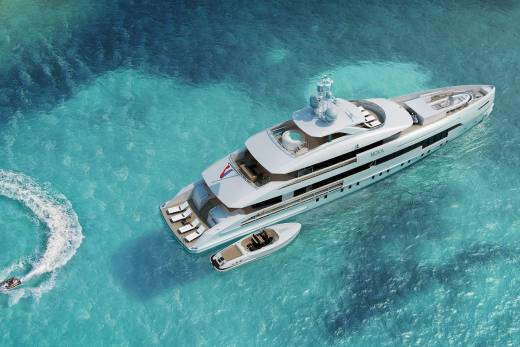 A luxurious yacht glides through crystal-clear turquoise waters, accompanied by jet skis and a tender.