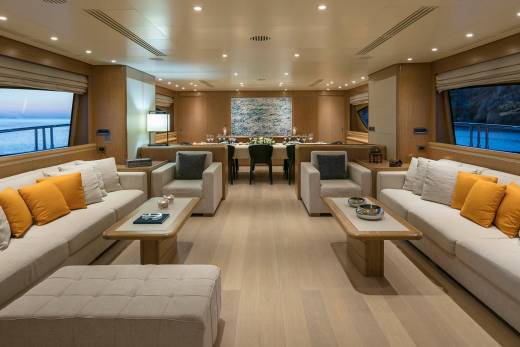 Luxurious yacht interiors offer comfortable seating and elegant dining areas with stunning ocean views.