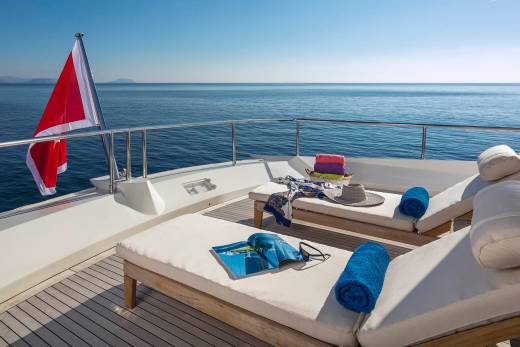 Relax on the deck of this luxurious yacht, surrounded by the tranquil blue of the open sea.