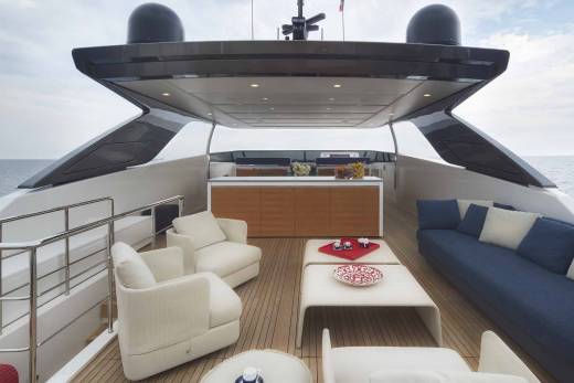 Luxurious outdoor seating on a yacht deck offers a serene setting for enjoying the ocean breeze and picturesque views.