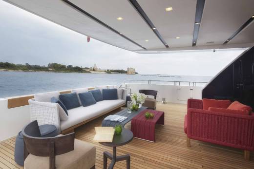 Relax on the luxurious deck of this yacht, enjoying the serene ocean views and charming coastal architecture.