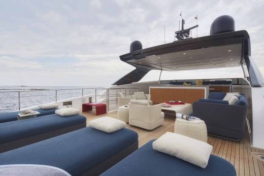 Relax on the spacious deck of this luxurious yacht, complete with comfortable seating and stunning ocean views.