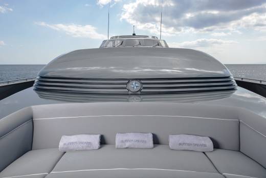 Relax on the plush seating of this luxurious yacht, with "Summer Dreams" embroidered towels ready for your comfort.