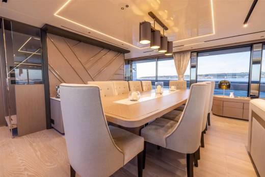 Dine in elegant style aboard this luxurious yacht, surrounded by sophisticated decor and panoramic ocean views.