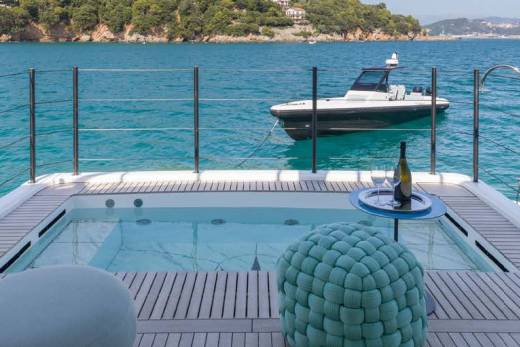 Relax in the onboard jacuzzi with a bottle of champagne while admiring the stunning coastal scenery.
