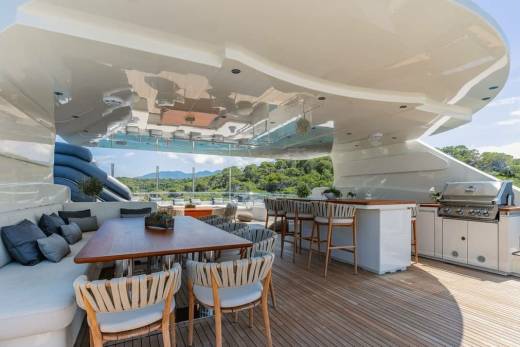 Enjoy al fresco dining and grilling on the spacious deck of this luxurious yacht, surrounded by stunning natural scenery.