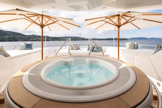 Relax in the soothing waters of this luxurious yacht jacuzzi while enjoying breathtaking views of the coastline.