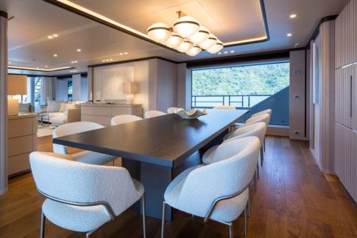 Dine in sophisticated style aboard this luxurious yacht, surrounded by elegant furnishings and breathtaking ocean views.