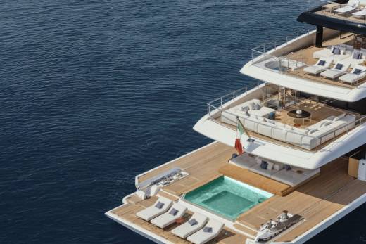 Luxurious yacht decks offer ample space for relaxation with plush seating, sun loungers, and a refreshing pool overlooking the deep blue sea.