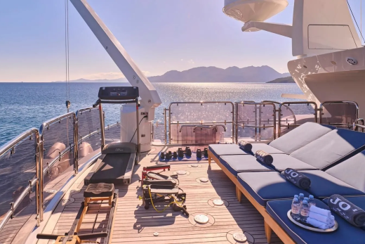 Enjoy a refreshing workout on the deck of this luxury yacht with stunning ocean views.