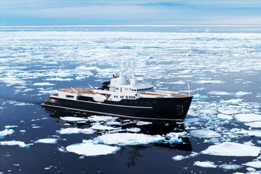 A large black ship navigates through the icy waters of the Arctic, surrounded by floating ice floes against a backdrop of a clear blue sky.