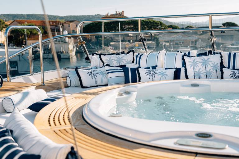 Relax in the onboard jacuzzi surrounded by plush pillows and the picturesque coastal scenery of the French Riviera.