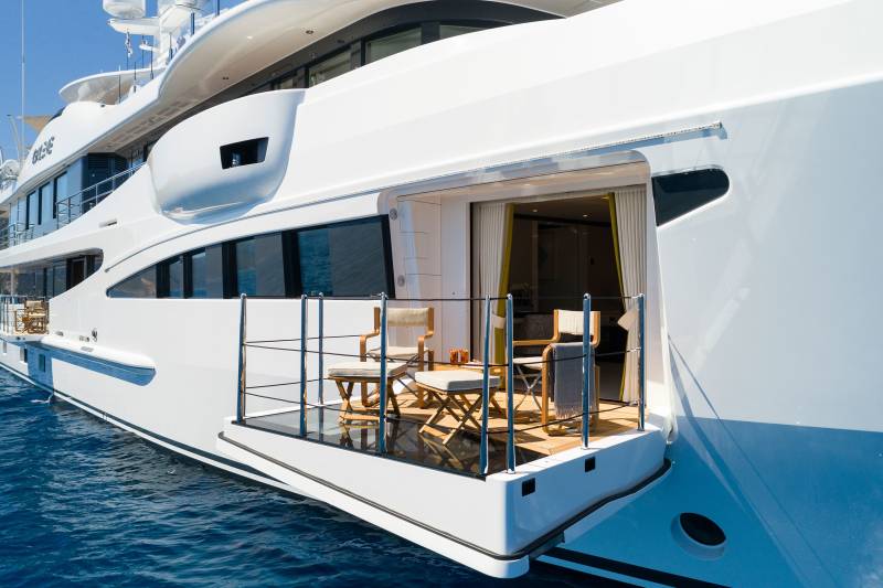 Relax on the deck of this luxurious yacht as it cruises through the clear blue waters.