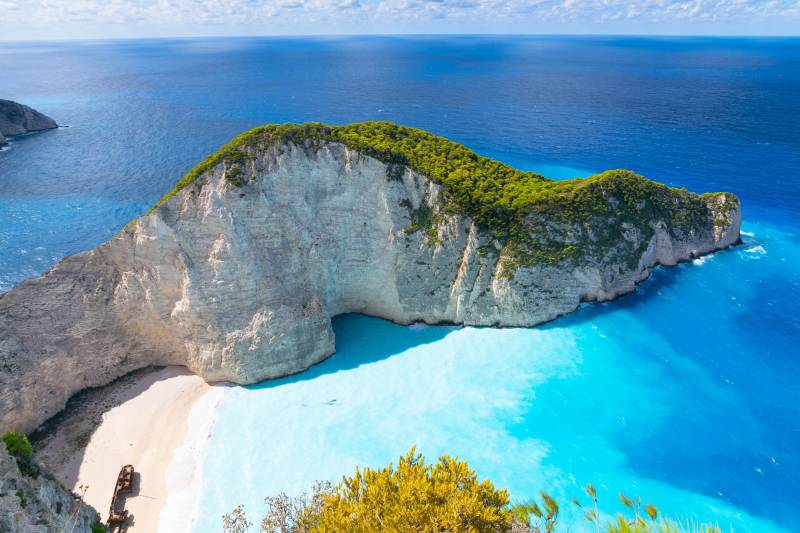 The iconic Shipwreck Beach on Zakynthos, Greece, beckons with its dramatic cliffs and impossibly blue waters.