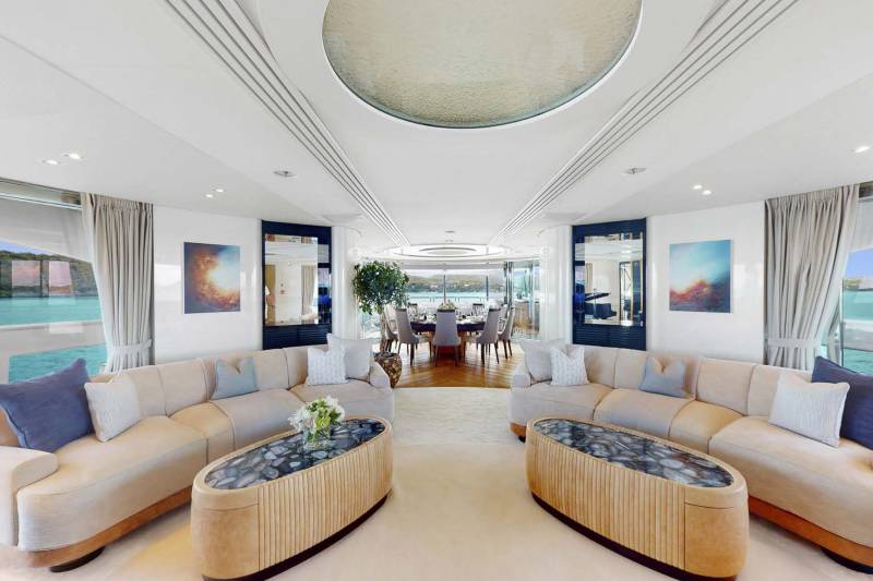 Luxurious yacht interiors offer stunning ocean views from plush seating areas and elegant dining spaces.