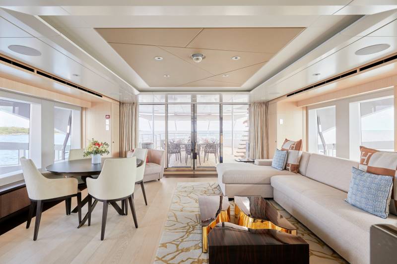 Luxurious yacht interiors seamlessly blend indoor comfort with breathtaking ocean views and outdoor living spaces.