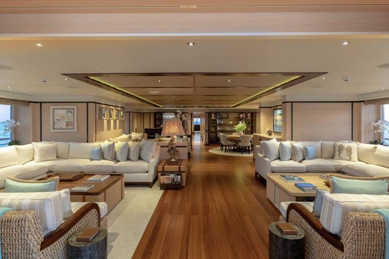 Luxurious yacht interiors offer expansive ocean views from plush seating areas and elegant dining spaces.