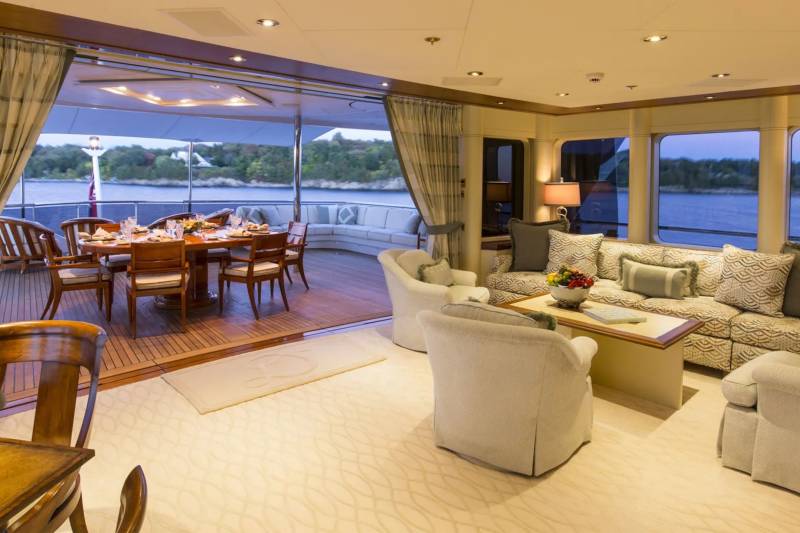 Elegant yacht interiors seamlessly blend indoor comfort with outdoor views, offering a luxurious retreat on the water.