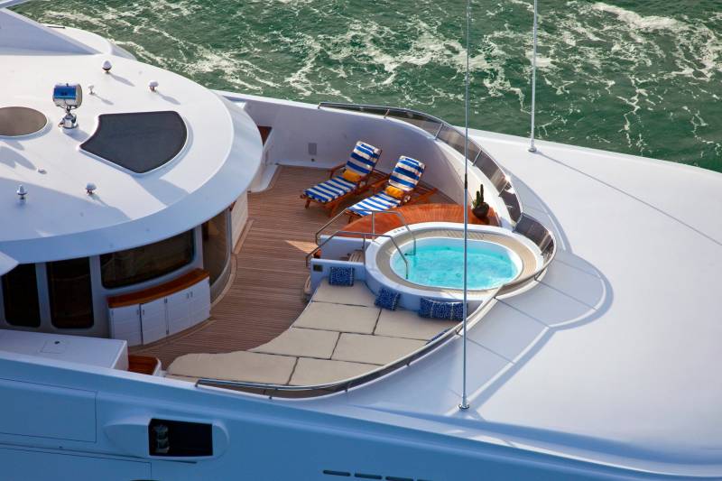 Relax in the onboard jacuzzi and soak up the sun on the spacious deck of this luxurious yacht.