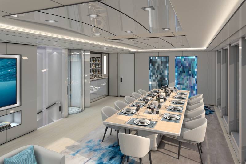 A luxurious yacht dining room features a long table set for a feast with a stunning ocean view.