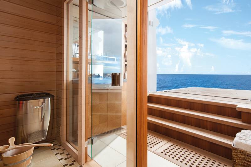 Relax in a luxurious sauna with a breathtaking view of the endless blue ocean.