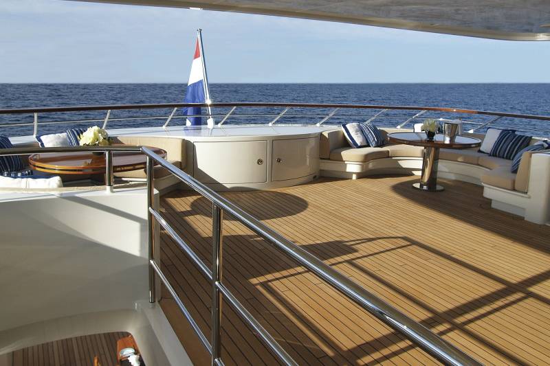 Relax on the spacious deck of this luxurious yacht, enjoying the serene ocean views and gentle sea breeze.