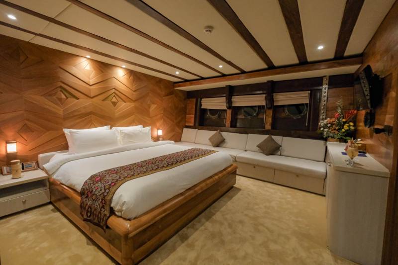 Luxurious wooden paneling and plush furnishings create a serene retreat aboard this elegant yacht.