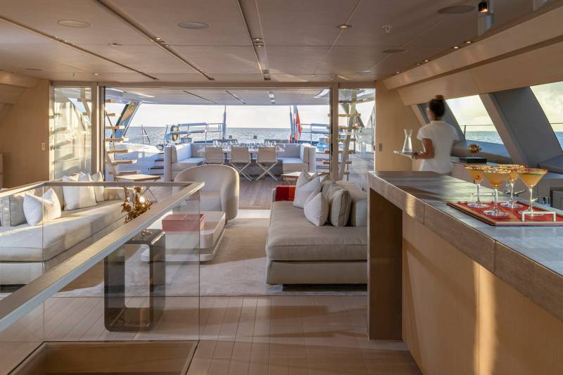 Enjoy cocktails with a stunning ocean view from this luxurious yacht's spacious lounge.