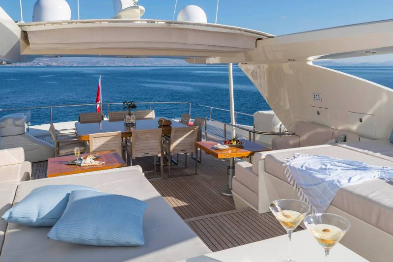 Relax on the spacious deck of a luxury yacht with stunning ocean views and refreshing cocktails.