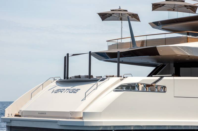 The luxurious yacht "Vertige" cruises through the Mediterranean Sea under a clear blue sky.