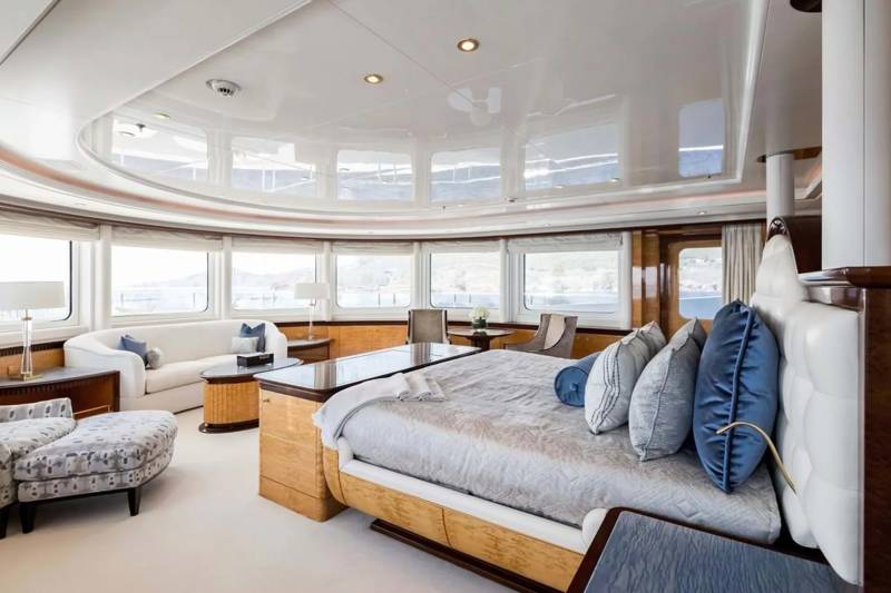Luxurious yacht interiors offer a serene retreat with plush furnishings and panoramic ocean views.