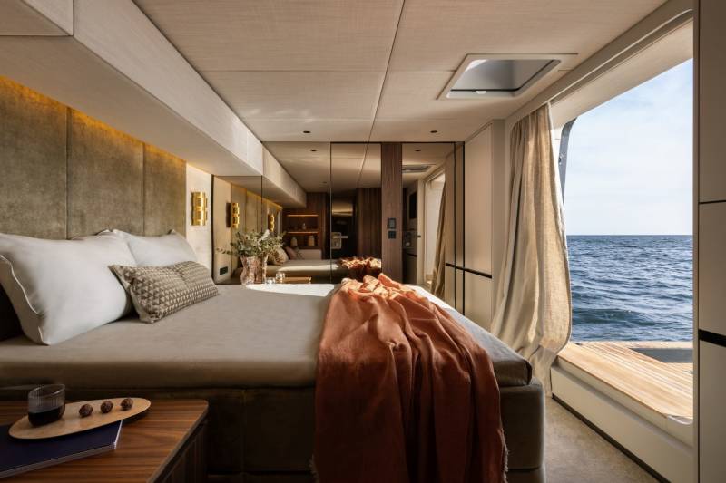 Wake up to the gentle rhythm of the ocean in this luxurious yacht bedroom with stunning sea views.