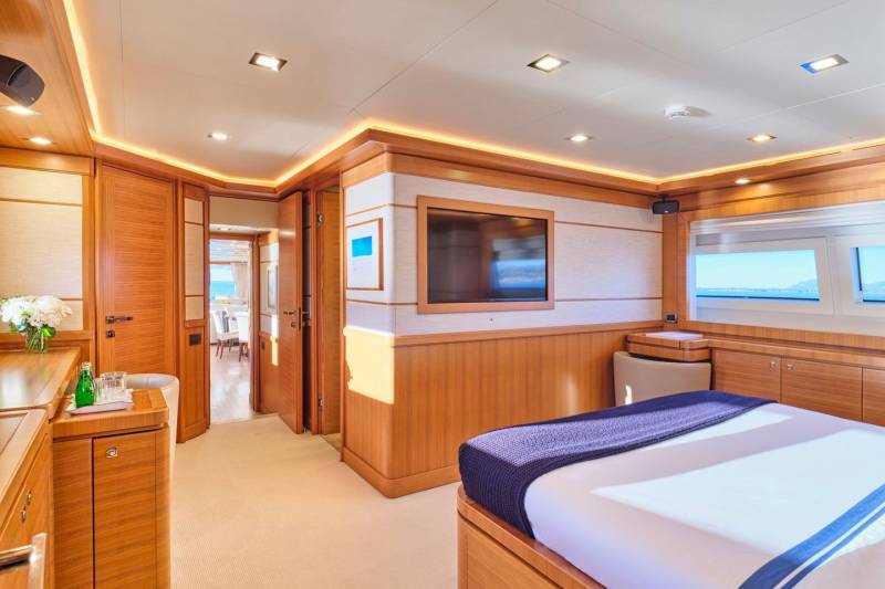 Luxurious yacht interiors boast warm wood finishes, ambient lighting, and stunning ocean views from every window.