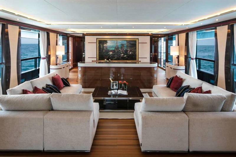 Luxurious yacht interiors offer breathtaking ocean views through expansive windows, creating a serene and elegant living space at sea.