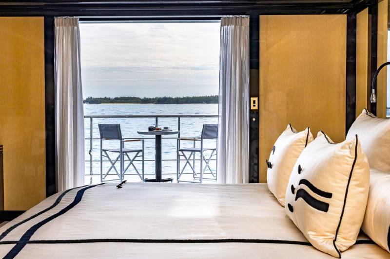 Wake up to breathtaking ocean views from this luxurious suite's private balcony.