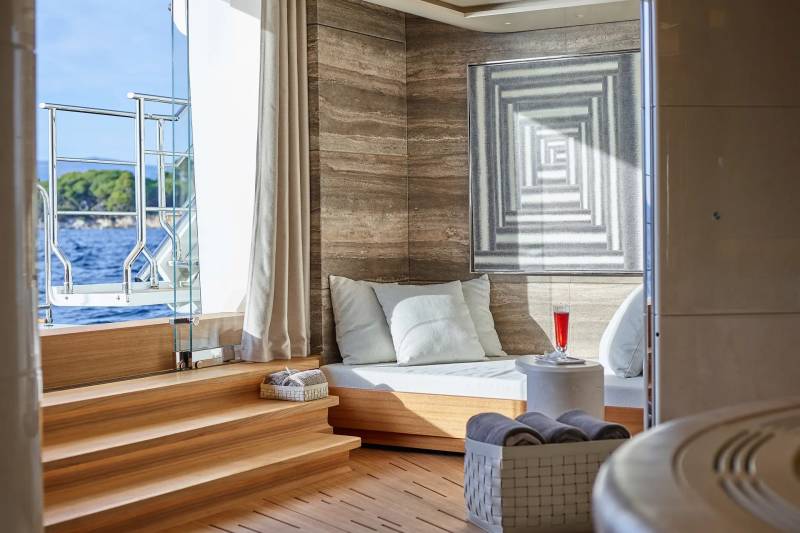 Relax in this serene yacht lounge with a refreshing drink and stunning ocean views.