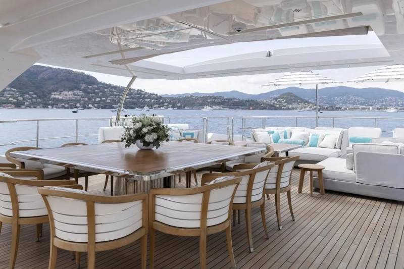 Dine al fresco on the spacious deck of this luxurious yacht, surrounded by stunning coastal views.