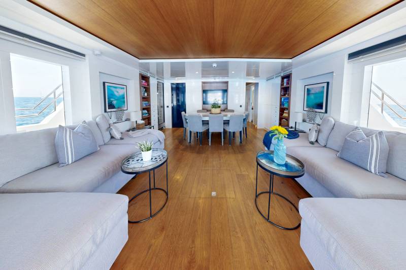 Luxurious yacht interiors offer a serene escape with comfortable seating, elegant dining, and stunning ocean views.