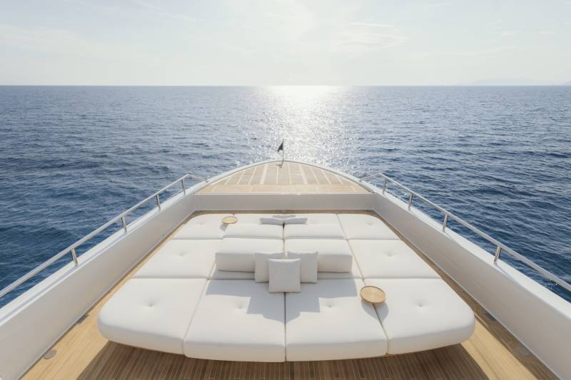 Relax on the spacious sun deck of this luxury yacht as the sun glints off the endless blue ocean.