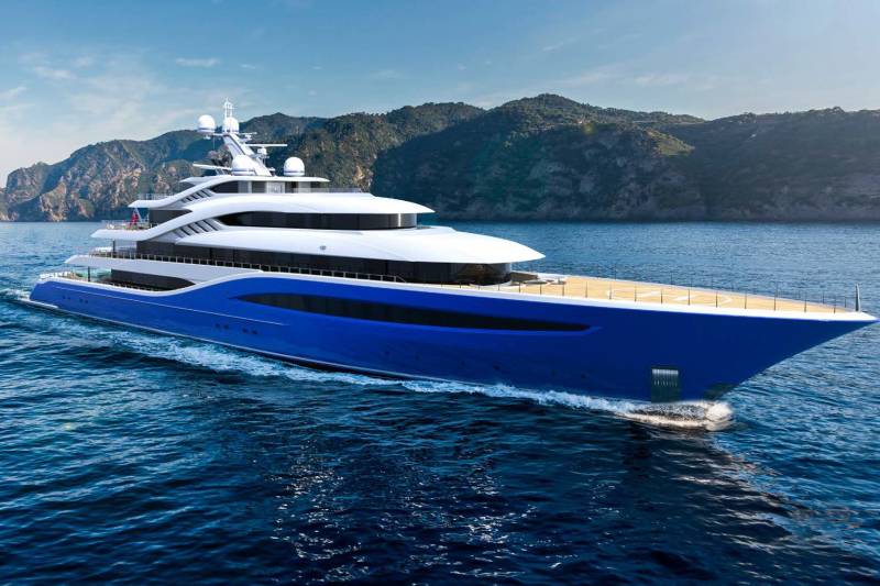 A large, luxurious yacht with a sleek, modern design is sailing across the deep blue waters, surrounded by rugged, mountainous terrain in the background.