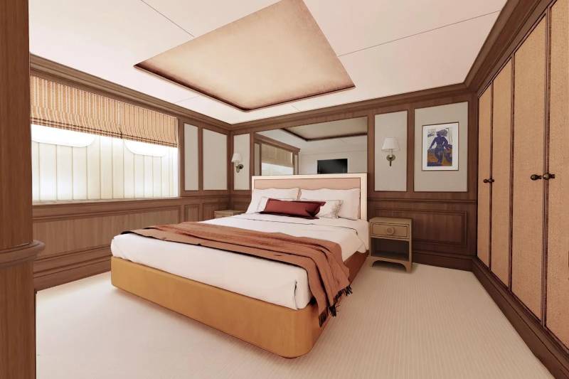 A cozy and well-furnished bedroom with a large bed, wooden paneling, and a skylight providing natural lighting.