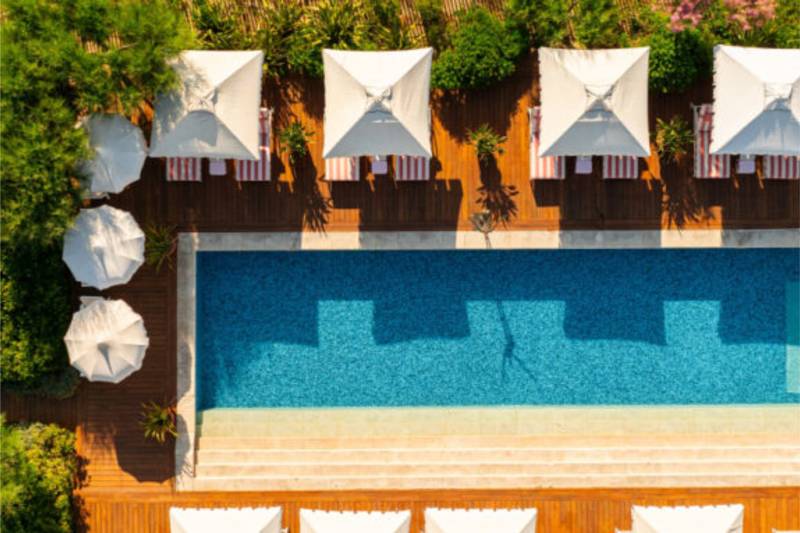 Dine al fresco under the dappled shade of olive trees at this stylish Mediterranean restaurant.